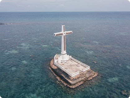 The Sunken Cemetery Cross Above the Waves
