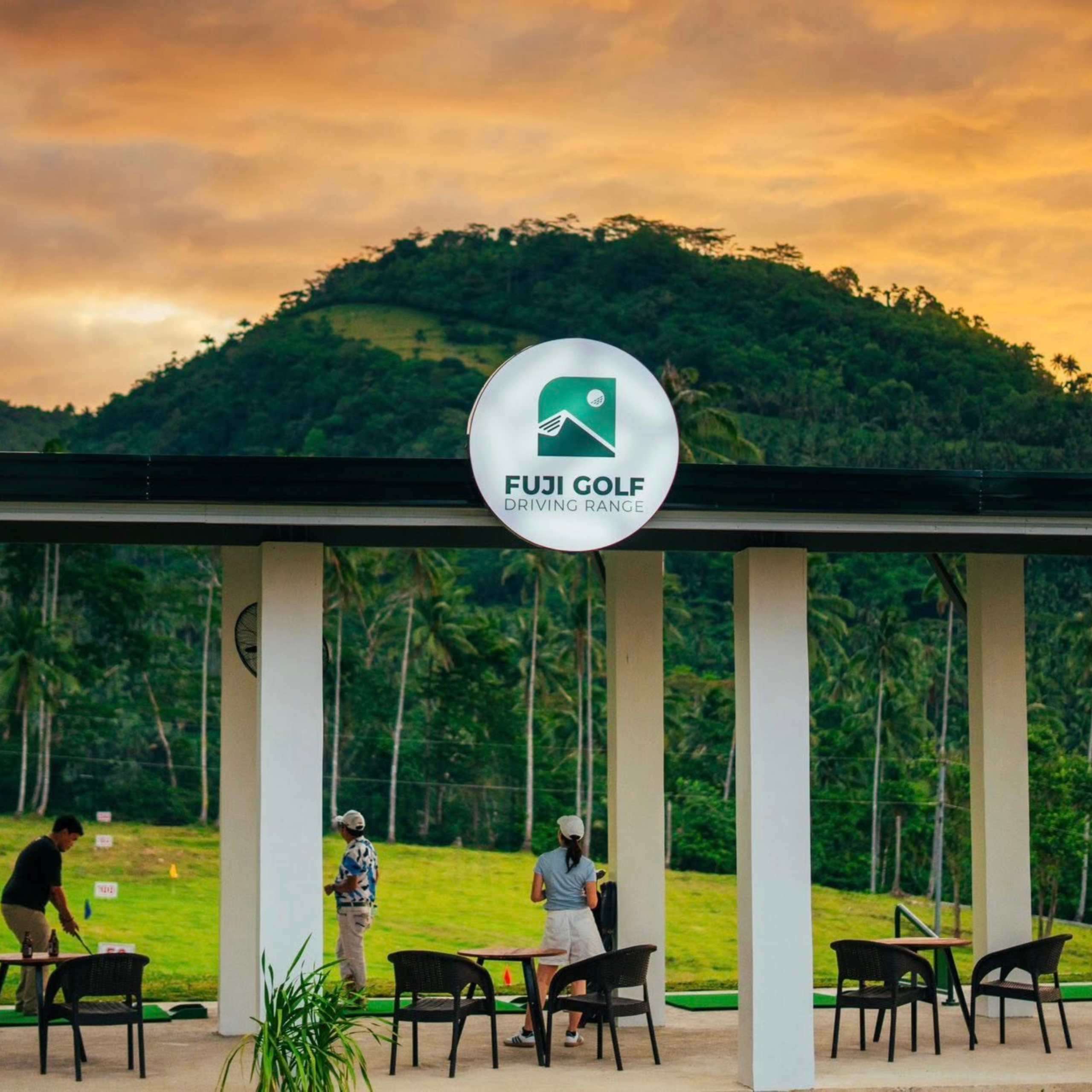 Fuji Golf Driving Range at sunset with palm trees