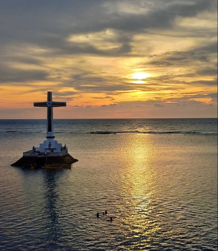 Viewing the Cross Above the Waves in Camiguin